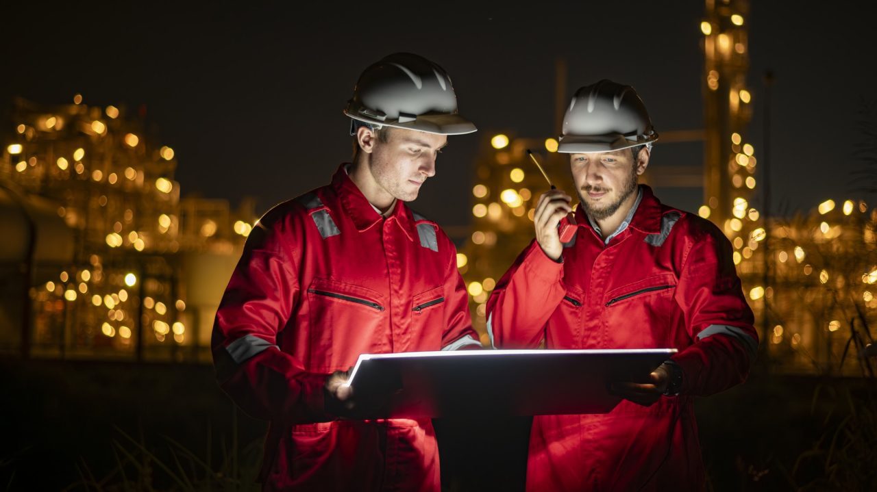 engineer-survey-team-wear-uniform-and-helmet-stand-workplace-checking-blueprint-project-and-radio-co.jpg