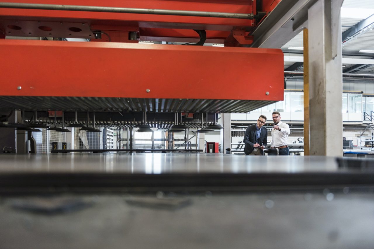 two-men-with-tablet-discussing-on-factory-shop-floor.jpg